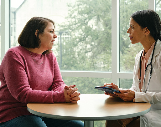 An image of Robin, bariatric patient, speaking with a doctor